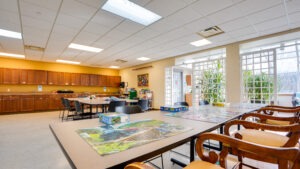 Game room with tables and chairs for group activities