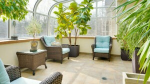 Sunroom with plants and seating area
