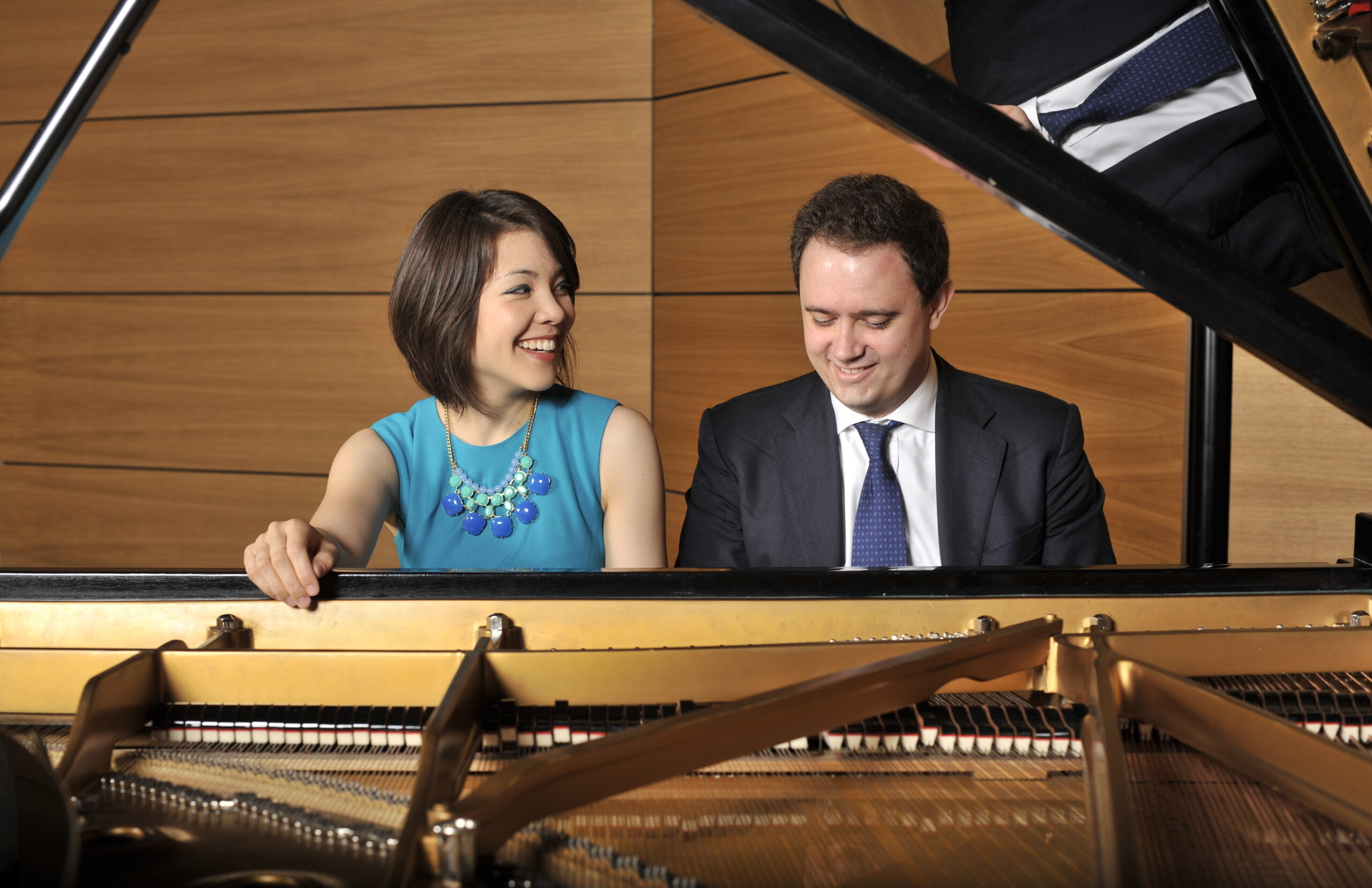 two pianist playing piano